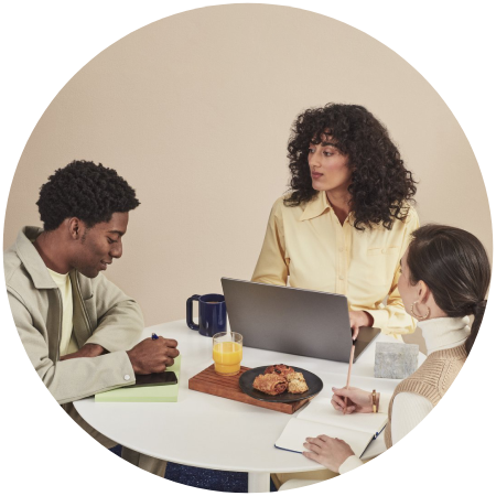 A group of people sitting around a table.